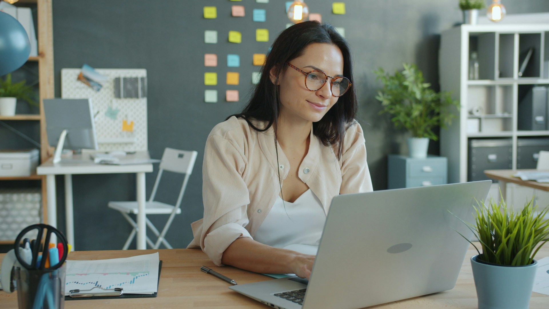 Women typing on computer calculating ROI