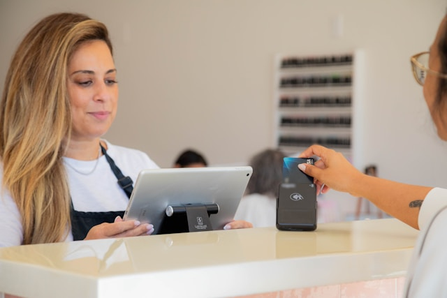 Cashier checking out a customer